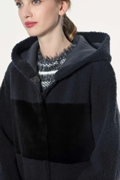 Reversible hooded sheepskin coat